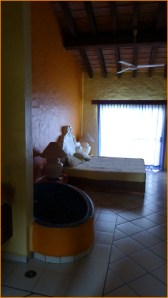 Photo of the bedroom with its soaking tub.