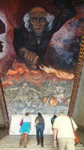 A gigantic mural of the Mexican Revolution by Jose Clemente Orozco dwarfs us on the stairs of the Jalisco capitol building