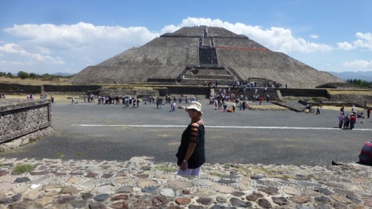 Louise stands in the foreground with the Pyramid of the Sun behind