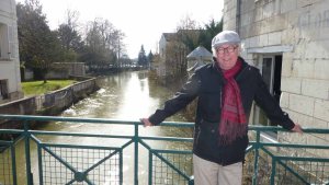 En route, Tom models his new scarf over the Indre River in Loches